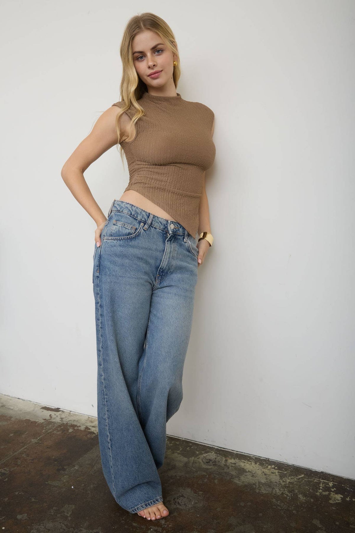 ASYMMETRICAL HEM MOCK NECK SLEEVELESS KNIT TOP